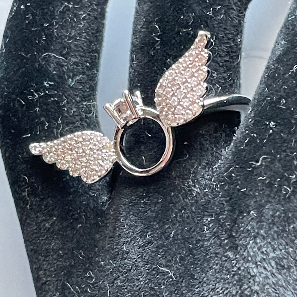 Silver 8 Ring with wings on a mini cz ring